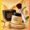 Lushari Loose Powder jar, box, and makeup brush in a warm beauty product setting